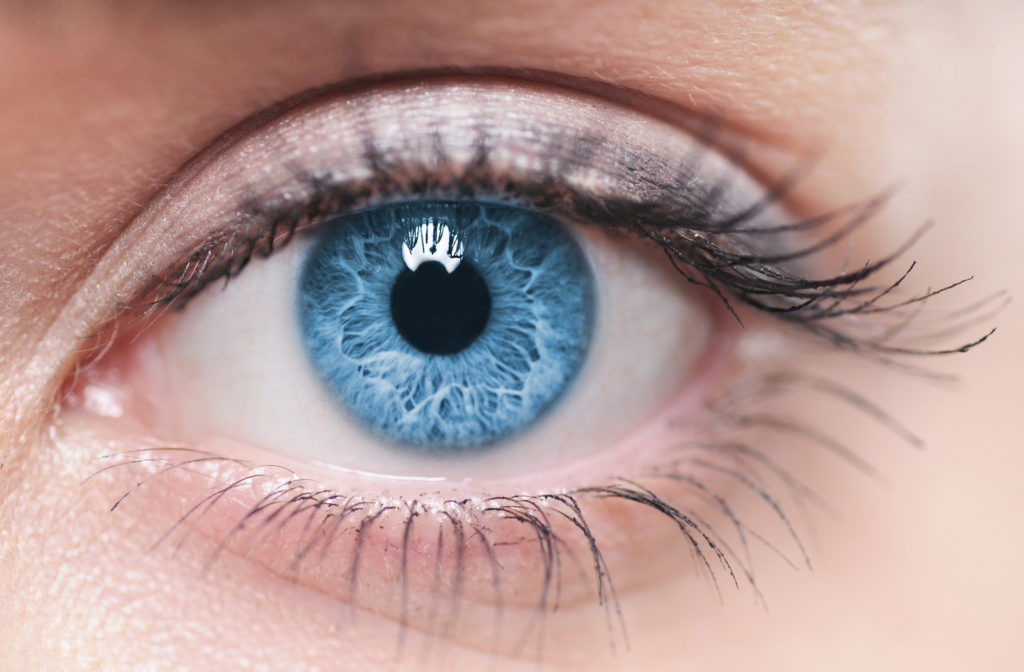 Close up of woman with blue eyes.